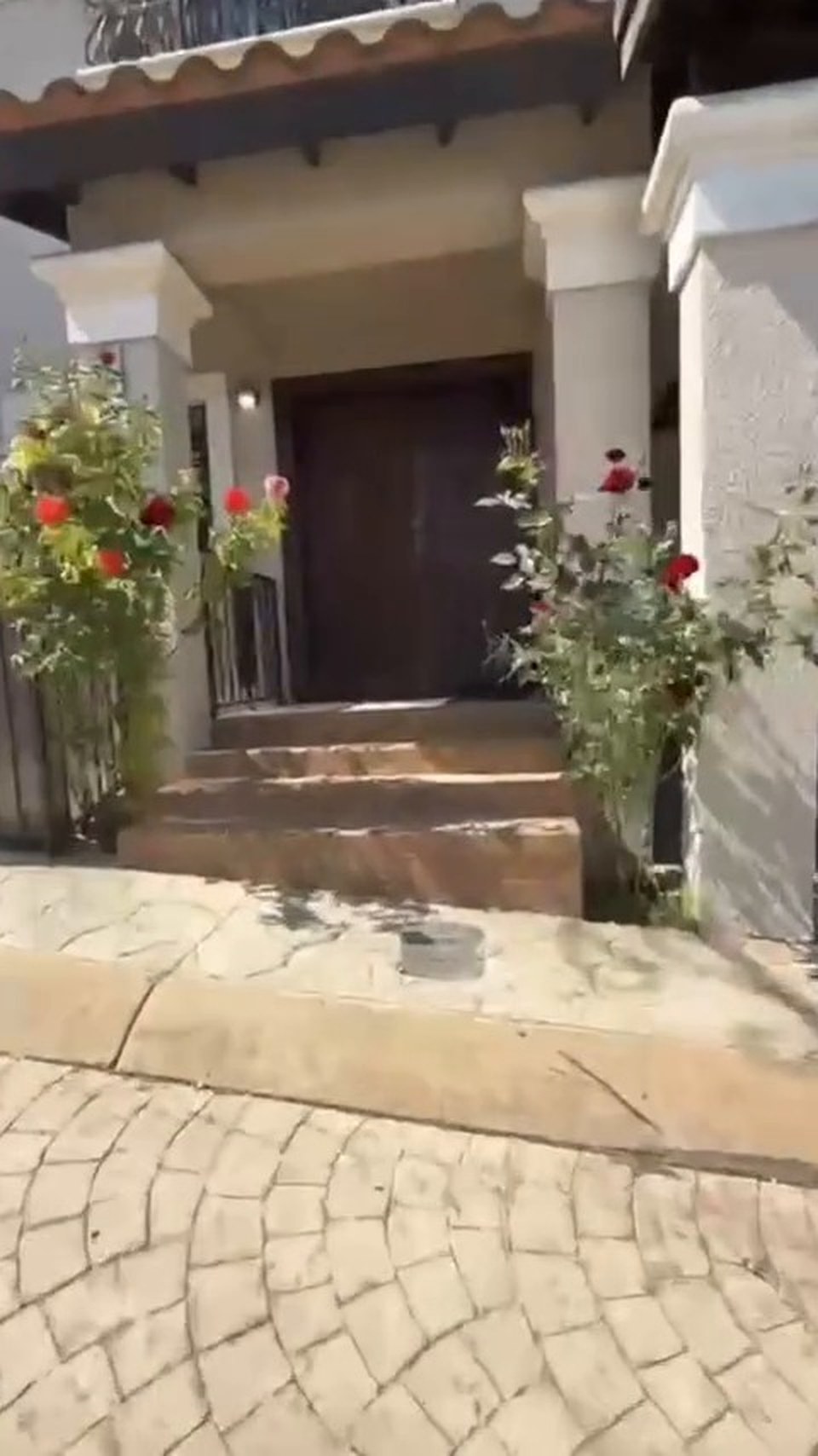 Front of the recovery house with rose bushes